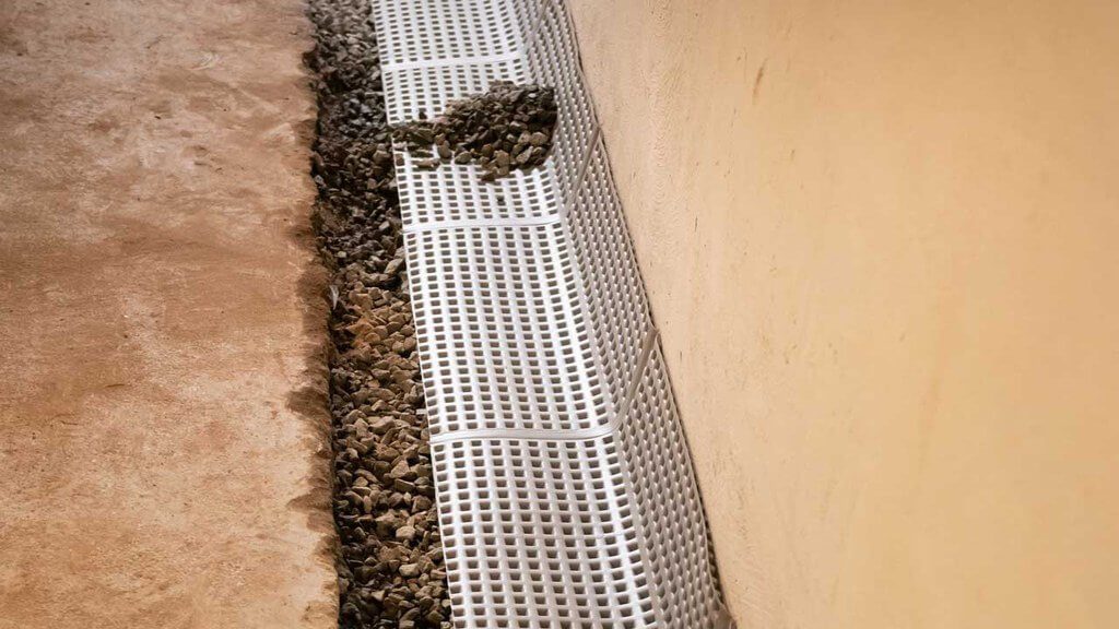 Waterproofing grates on top of basement foundation