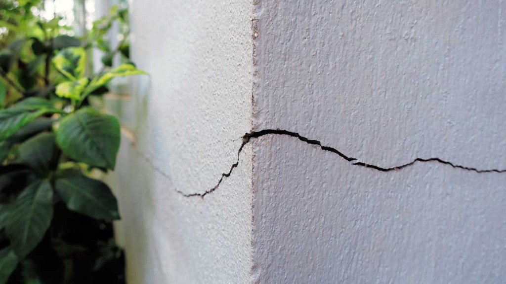 Crack spreading on corner of home exterior indication foundation problem