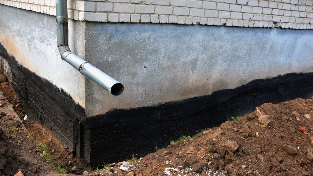 Waterproofing sealant coated onto exterior of basement foundation