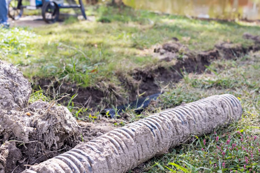 French drain pipe dug up for repair