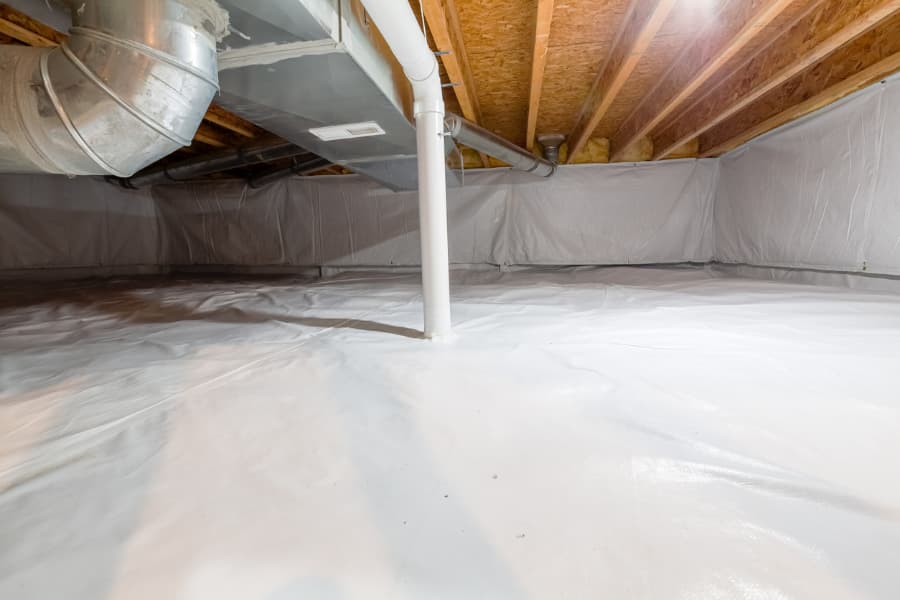 View of crawl space completely protected with vapor barrier