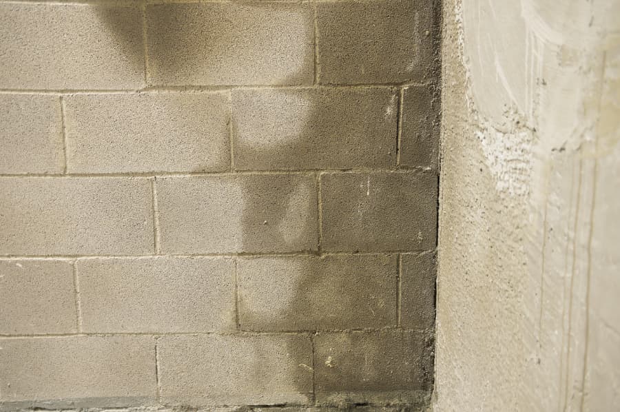 Water entering basement walls after heavy rainfall