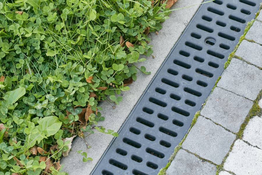 Trench drain system along walkway